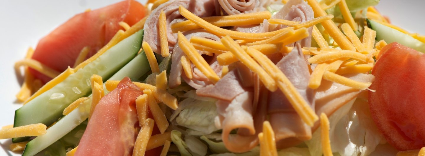 chef salad with tomatoes, cucombers, ham and cheese